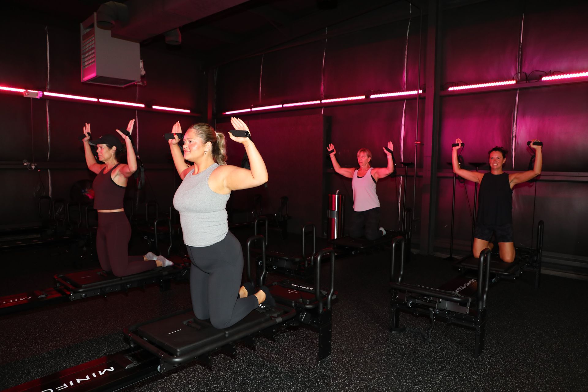Members in a Lagree Pilates class at The Studio 205